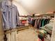 Spacious walk-in closet offering ample storage with shelving and racks for organizing clothes and personal items at 1178 Chambord Ne Way, Brookhaven, GA 30319