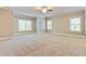 Spacious bedroom with plush carpet, neutral walls, and ample natural light at 3821 Chamblee Dunwoody Rd, Atlanta, GA 30341