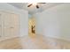 Bedroom featuring a ceiling fan, a closet, and a view to a hallway at 3821 Chamblee Dunwoody Rd, Atlanta, GA 30341
