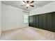 Spacious bedroom with panel accent wall and neutral carpet at 3821 Chamblee Dunwoody Rd, Atlanta, GA 30341