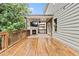 Covered deck with a fireplace and a TV at 3821 Chamblee Dunwoody Rd, Atlanta, GA 30341