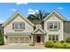 Charming two-story home with a welcoming entrance, complemented by lush landscaping and a two-car garage at 3821 Chamblee Dunwoody Rd, Atlanta, GA 30341
