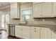 Bright kitchen with stainless steel appliances, light granite countertops, and convenient access to the outdoor area at 3821 Chamblee Dunwoody Rd, Atlanta, GA 30341