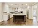 Modern kitchen featuring white cabinetry, stainless steel appliances, granite countertops, and a central island at 3821 Chamblee Dunwoody Rd, Atlanta, GA 30341