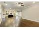 Bright open-concept living space with hardwood floors connected to the kitchen with a dark wood island at 3821 Chamblee Dunwoody Rd, Atlanta, GA 30341