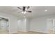 Spacious living room with light wood floors, recessed lighting and a modern ceiling fan at 3821 Chamblee Dunwoody Rd, Atlanta, GA 30341