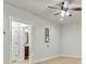 Bright living room with light wood floors leading to a bathroom at 3821 Chamblee Dunwoody Rd, Atlanta, GA 30341