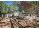 Landscaped backyard showcasing a patio and mature tree coverage at 4446 Huntington Cir, Atlanta, GA 30338
