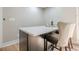 Wet bar with white countertop and seating for two at 4446 Huntington Cir, Atlanta, GA 30338