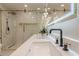 Modern bathroom boasting double sinks and a shower with frameless glass doors and gold hardware at 4446 Huntington Cir, Atlanta, GA 30338