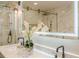 Elegant bathroom with double vanity, frameless glass shower, and modern lighting above the vanity at 4446 Huntington Cir, Atlanta, GA 30338