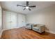Bedroom with hardwood floors features seating area and double closets for ample storage at 4446 Huntington Cir, Atlanta, GA 30338