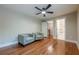 Bedroom shows hardwood floors and access to bathroom and staircase at 4446 Huntington Cir, Atlanta, GA 30338