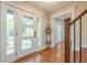 Bright entryway featuring hardwood floors, a modern door, and stylish decor at 4446 Huntington Cir, Atlanta, GA 30338
