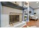 Close-up of a stylish fireplace with a decorative screen and built-in shelving at 4446 Huntington Cir, Atlanta, GA 30338