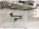This kitchen features custom tile backsplash, and a pot filler for the gourmet chef at 4446 Huntington Cir, Atlanta, GA 30338