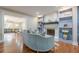 Elegant living room with a fireplace, built-in shelving, and a view into the dining area at 4446 Huntington Cir, Atlanta, GA 30338