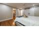 This main bedroom features hardwood floors and custom barn doors to the bathroom at 4446 Huntington Cir, Atlanta, GA 30338
