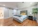 This main bedroom features hard wood floors and custom barn doors to the main bathroom at 4446 Huntington Cir, Atlanta, GA 30338