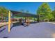 Community playground with shade structure and play equipment at 4446 Huntington Cir, Atlanta, GA 30338