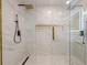 Modern bathroom with a frameless glass shower, gold accents, and a unique hexagon tile floor at 4446 Huntington Cir, Atlanta, GA 30338