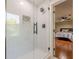 Shower showcases bright white tiles, black hardware, and a modern niche shelf at 4446 Huntington Cir, Atlanta, GA 30338