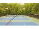 Outdoor tennis courts offer a great space for friendly matches and skill practice with mature trees providing shade at 4446 Huntington Cir, Atlanta, GA 30338