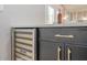 Modern wet bar with built-in wine fridge, liquor, and stemware at 4446 Huntington Cir, Atlanta, GA 30338
