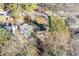 Homes with roof and backyard are visible between the trees from an aerial view at 1824 Westwood Sw Ave, Atlanta, GA 30310
