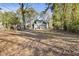 Spacious backyard with mature trees and lush greenery, creating a peaceful and private setting at 1824 Westwood Sw Ave, Atlanta, GA 30310
