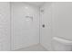 Clean and bright shower features white subway tile surround, rain shower head, and hexagonal tile floor at 1824 Westwood Sw Ave, Atlanta, GA 30310