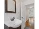 Bathroom features sleek mirror and stylish vanity with modern faucet at 1824 Westwood Sw Ave, Atlanta, GA 30310