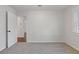 Inviting bedroom featuring carpeting, natural light, and a glimpse into the connecting room at 1824 Westwood Sw Ave, Atlanta, GA 30310