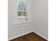 Bedroom featuring a window with wood trim, fresh paint and hardwood floors at 1824 Westwood Sw Ave, Atlanta, GA 30310