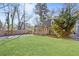 Eye-catching exterior of a home with a sprawling green lawn, mature trees, and a cozy, inviting curb appeal at 1824 Westwood Sw Ave, Atlanta, GA 30310
