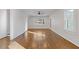 Bright living room with beautiful hardwood floors, large windows, and modern ceiling fan at 1824 Westwood Sw Ave, Atlanta, GA 30310