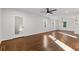 Open floorplan features hardwood floors, fresh paint and updated ceiling fan and lighting fixtures at 1824 Westwood Sw Ave, Atlanta, GA 30310