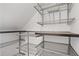 Organized walk-in closet with metal racks and shelving for efficient storage solutions at 1824 Westwood Sw Ave, Atlanta, GA 30310
