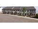 New townhomes with varied color schemes, brick accents, and well-maintained landscaping offers curb appeal at 347 Skylar Se Ct, Atlanta, GA 30315