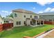 Large backyard with a covered patio, swing, and grassy area, perfect for outdoor activities at 3652 Terrah Point Dr, Duluth, GA 30097