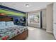 Comfortable bedroom features bright, colorful decor, natural lighting, and an ideal setup for study and relaxation at 3652 Terrah Point Dr, Duluth, GA 30097