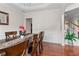 Formal dining room with hardwood floors, wainscoting, and a view of the staircase at 3652 Terrah Point Dr, Duluth, GA 30097