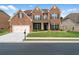 Attractive two-story brick home with a well-kept lawn and attached two-car garage at 3652 Terrah Point Dr, Duluth, GA 30097