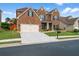 Beautiful two-story brick home featuring a two-car garage and a well-maintained lawn at 3652 Terrah Point Dr, Duluth, GA 30097