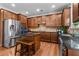 Modern kitchen with stainless steel appliances, granite countertops, and wood cabinets at 3652 Terrah Point Dr, Duluth, GA 30097