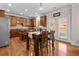 Eat-in kitchen featuring stainless steel appliances, granite counters, and wood cabinets at 3652 Terrah Point Dr, Duluth, GA 30097