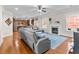 Spacious living room with hardwood floors, fireplace, and an open layout to the kitchen at 3652 Terrah Point Dr, Duluth, GA 30097