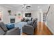 Inviting living room with a cozy fireplace, ceiling fan, and hardwood floors at 3652 Terrah Point Dr, Duluth, GA 30097