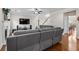 Open-concept living area with hardwood floors and view into the dining area at 3652 Terrah Point Dr, Duluth, GA 30097