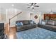 Spacious living room with hardwood floors, comfortable seating, and open layout at 3652 Terrah Point Dr, Duluth, GA 30097